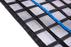 Black FRC-MESH Gen2 scaffold containment mesh close-up with blue reinforcement stripe