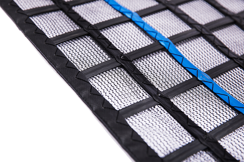 Black FRC-MESH Gen2 scaffold containment mesh close-up with blue reinforcement stripe